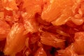 Red honey pomelo peeled and disassembled into slices Royalty Free Stock Photo