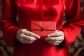 Red hongbao envelope in female hands, Chinese tradition