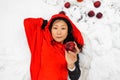 Red Hooded Woman Holding an Apple Fairytale Portrait in winter forest. Royalty Free Stock Photo