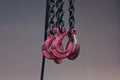 Red hooks on chains Royalty Free Stock Photo