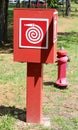 red hose container for extinguishing fires and column hydrant fo Royalty Free Stock Photo