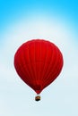 Red hot air ballon in the blue sky Royalty Free Stock Photo