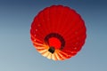 Red hot air balloon against the blue sky Royalty Free Stock Photo