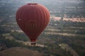 Red Hot Air Balloon Over Asian Countryside Bagan, Myanmar (Burma). Royalty Free Stock Photo