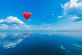 Red hot air balloon in the shape of a heart. Royalty Free Stock Photo