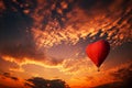 Red hot air balloon in the shape of a heart, Colorful hot-air balloon flying