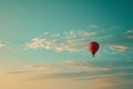 Red Hot Air Balloon Soaring Through Blue Sky, A plainly colored sky with a single hot air balloon floating, AI Generated