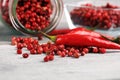 Red hot bird chili pepper with pepper corns Royalty Free Stock Photo
