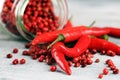 Red hot bird chili pepper with pepper corns Royalty Free Stock Photo