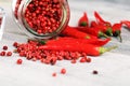 Red hot bird chili pepper with pepper corns Royalty Free Stock Photo