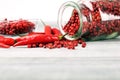 Red hot bird chili pepper with pepper corns Royalty Free Stock Photo