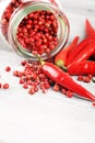 Red hot bird chili pepper with pepper corns Royalty Free Stock Photo