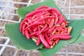 Red hot chili on banana leaf for sale in market, Thailand.