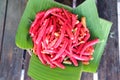 Red hot chili on banana leaf for sale in market, Thailand.