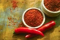 Red hot chili Cayenne pepper fresh and dried powdered spice, ready to use. Royalty Free Stock Photo