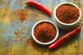 Red hot chili Cayenne pepper fresh and dried powdered spice, ready to use. Royalty Free Stock Photo