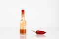 Red Hot Chili Pepper And Bottle Of Chili Sauce Royalty Free Stock Photo