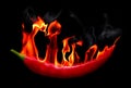 Red Hot chili pepper on fire and smoke Royalty Free Stock Photo