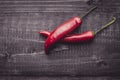 Red Hot Chili Peppers on Dark Rustic Wood Background Royalty Free Stock Photo