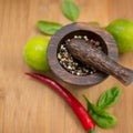 Red Hot Chili Peppers, lime and spices with Mortar and Pestle Royalty Free Stock Photo