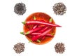 Red hot chili peppers and mixed of pepper corns on white background Royalty Free Stock Photo