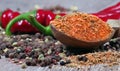 Red hot chili peppers and a mixture of different peppers on a wooden table. traditional spices. Royalty Free Stock Photo