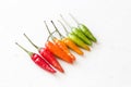 Red Hot Chili Peppers On Modern Background or White Table. A Lot of Red Chilli Peppers. Green Hot Chili Peppers. Copy space for Royalty Free Stock Photo