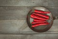 Red Hot Chili Peppers and pan on vintage wooden board. Top view with copy space. Royalty Free Stock Photo