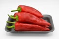 Red hot chili peppers. Very fresh and bright, in black plates