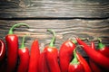 Red hot chili peppers on wood background Royalty Free Stock Photo