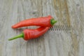 Red hot chili peppers on wooden table, decorate