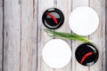 Red hot chilli pepper and scallions on plate Royalty Free Stock Photo