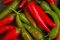 Red hot chilli peppers. Heap of red and green pepper. Bright natural background. Cayenne peppers. Colourful spicy peppers