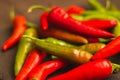 Red hot chilli peppers. Heap of red and green pepper. Bright natural background. Cayenne peppers. Colourful spicy peppers