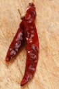 Red hot chillies pepper on old wood Royalty Free Stock Photo