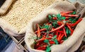 red hot chillies in a sack on the market Royalty Free Stock Photo