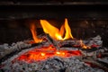 Red hot coals and live fire, flame. Burning firewood. . Royalty Free Stock Photo