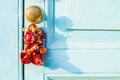 Red hot dried peppers hanging on a door