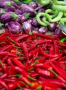 Red hot fresh raw chili peppers, eggplants and zucchini Royalty Free Stock Photo