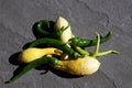 Red hot green chili peppers and yellow crookneck squash Royalty Free Stock Photo