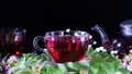 Red hot hibiscus tea in glass mug. Tea time: cup of tea, carcade, karkade, rooibos. Oriental, cozy, ceremony, tradition, japanese