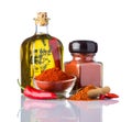 Red Hot Paprika Powder and Olive Oil on White Background Royalty Free Stock Photo
