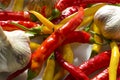 ,Red hot pepper, garlic. Red, yellow hot chili peppers, garlic cloves, ingredients on a white background as a design element
