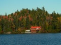 Red house on the lake shore Royalty Free Stock Photo