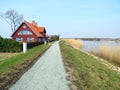 Red house near river Royalty Free Stock Photo