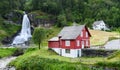 Red house near Steinsdalsfossen waterfall Royalty Free Stock Photo