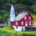 Red house near Steinsdalsfossen waterfall Royalty Free Stock Photo