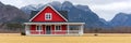 A red house sitting in a field with mountains behind it, AI Royalty Free Stock Photo