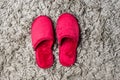 Red house slippers on gray carpet Royalty Free Stock Photo