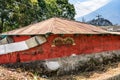 Red house with volcano behind, Antigua, Guatemala Royalty Free Stock Photo